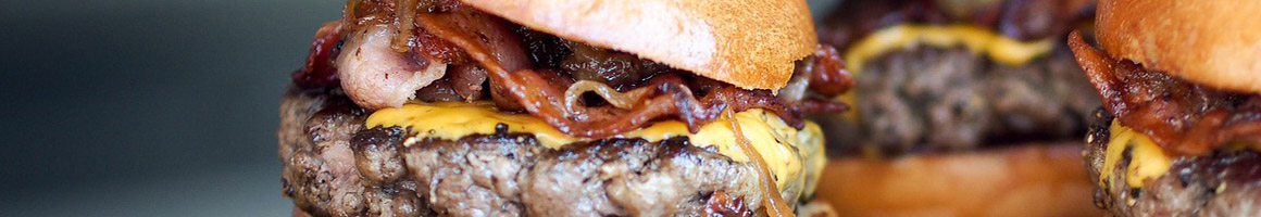 Eating American (Traditional) Burger at Mount Pleasant Burgers & Fries restaurant in Mt Pleasant, TX.